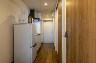 mr kinjo in front of manza beach