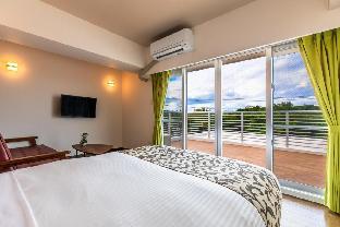 mr kinjo in front of manza beach