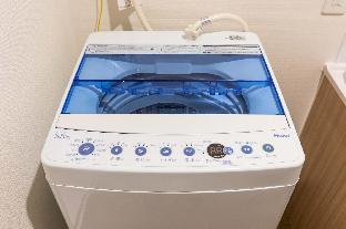 mr kinjo in front of manza beach