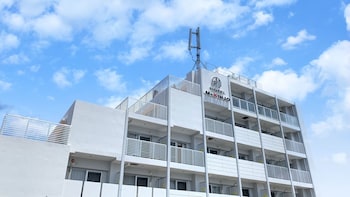 mr kinjo in front of manza beach