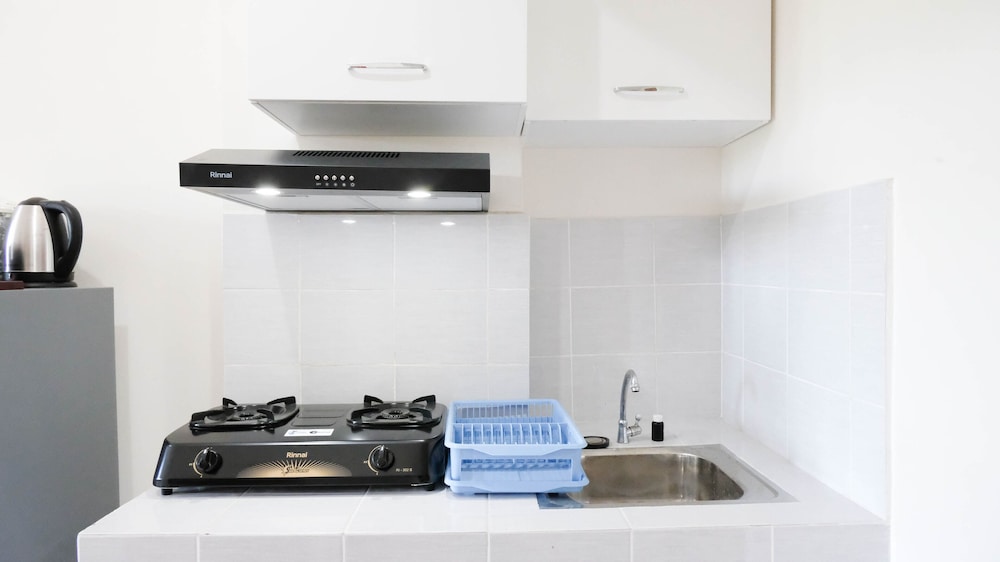 modern and homey 2br at puncak kertajaya apartment