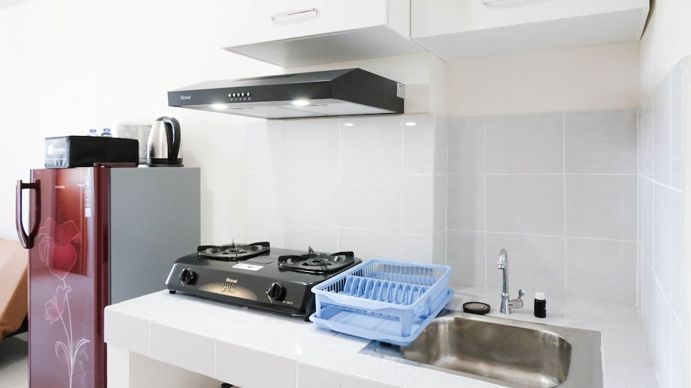 modern and homey 2br at puncak kertajaya apartment