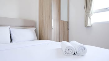 modern and homey 2br at puncak kertajaya apartment