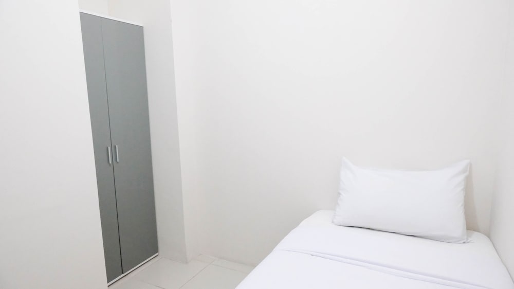 modern and homey 2br at puncak kertajaya apartment
