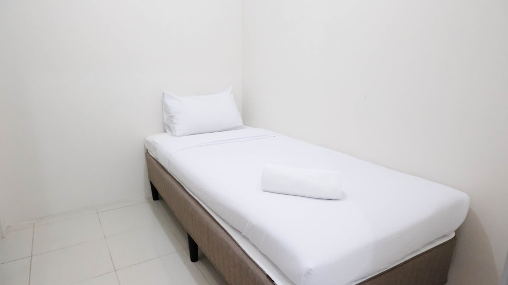 modern and homey 2br at puncak kertajaya apartment