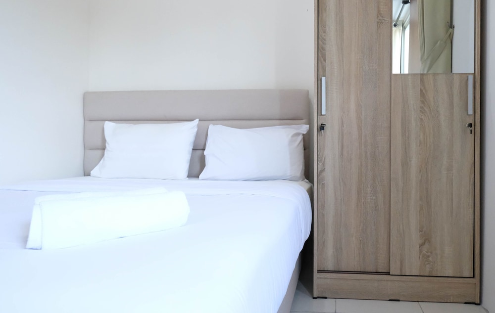 modern and homey 2br at puncak kertajaya apartment