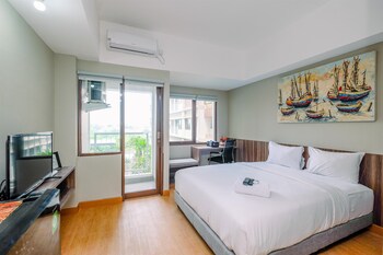 comfortable pool view studio room at gateway park lrt city bekasi apartment