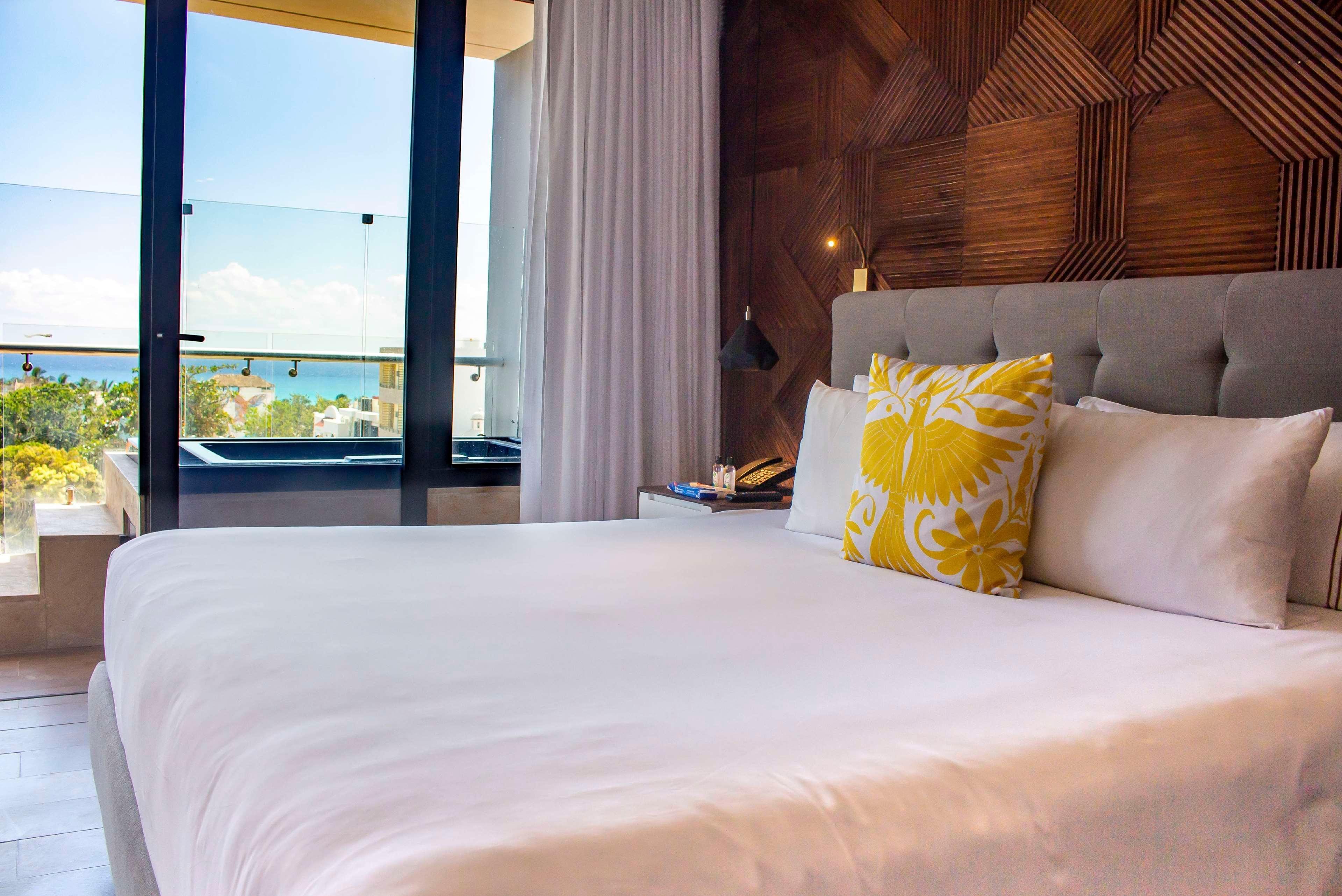the fives downtown hotel curio by hilton