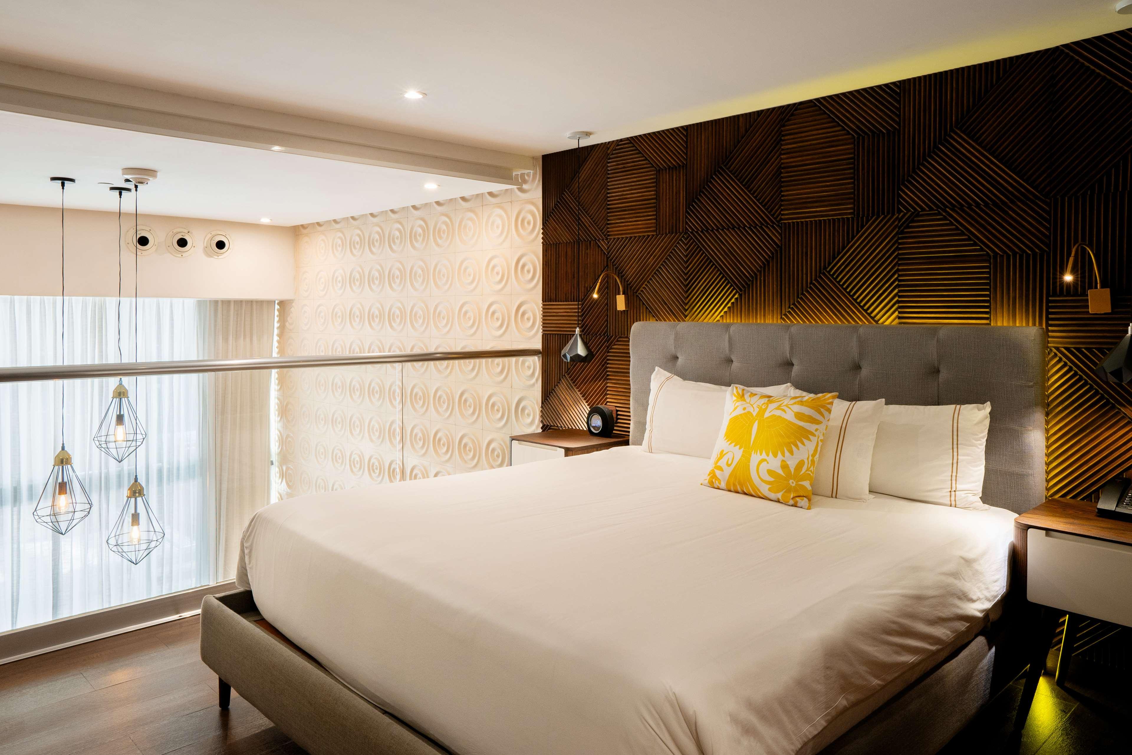 the fives downtown hotel curio by hilton