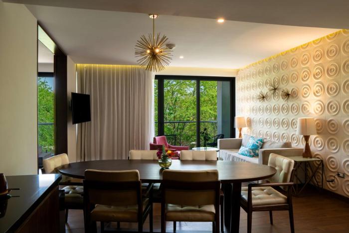 the fives downtown hotel curio by hilton