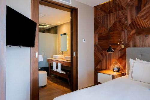 the fives downtown hotel curio by hilton