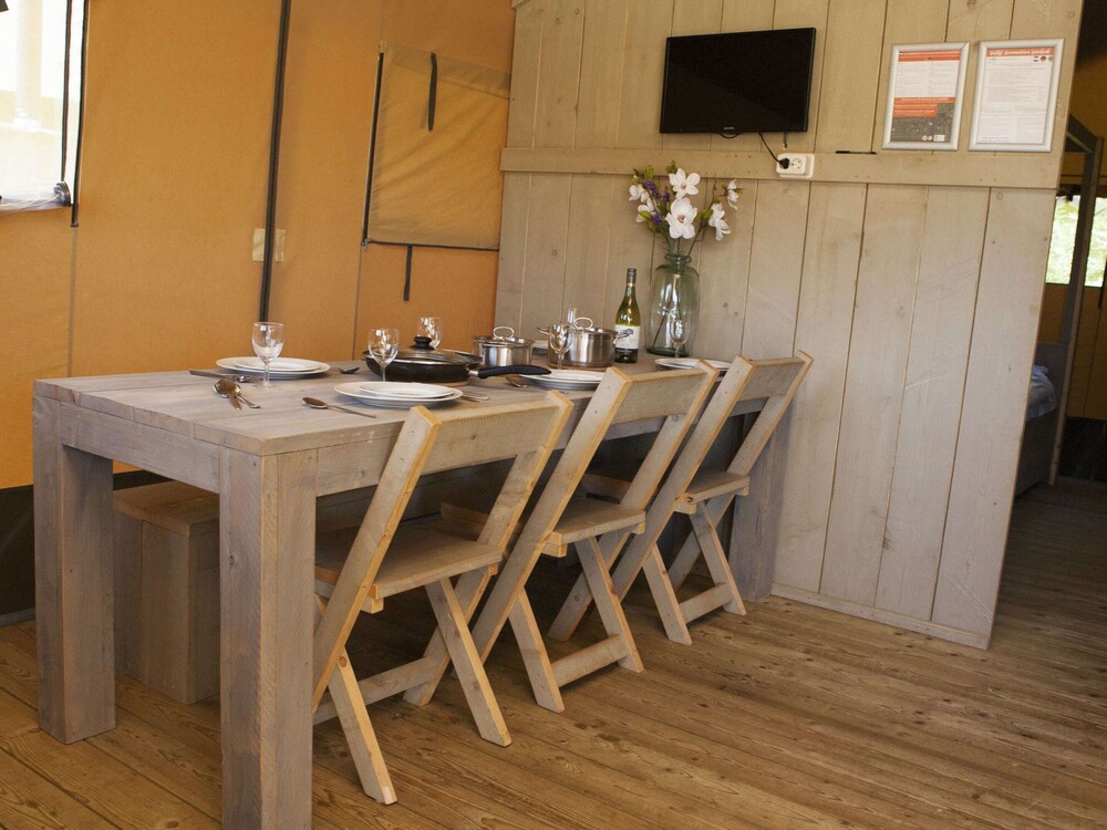 comfortably furnished tent lodge with stove near the veluwe