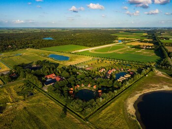 combined chalets with a bathroom located near a pond