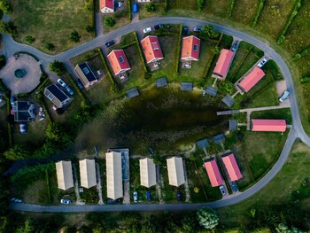combined chalets with a bathroom located near a pond