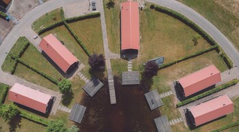 combined chalets with a bathroom located near a pond