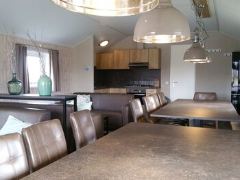 combined chalets with a bathroom located near a pond