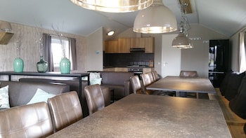 combined chalets with a bathroom located near a pond