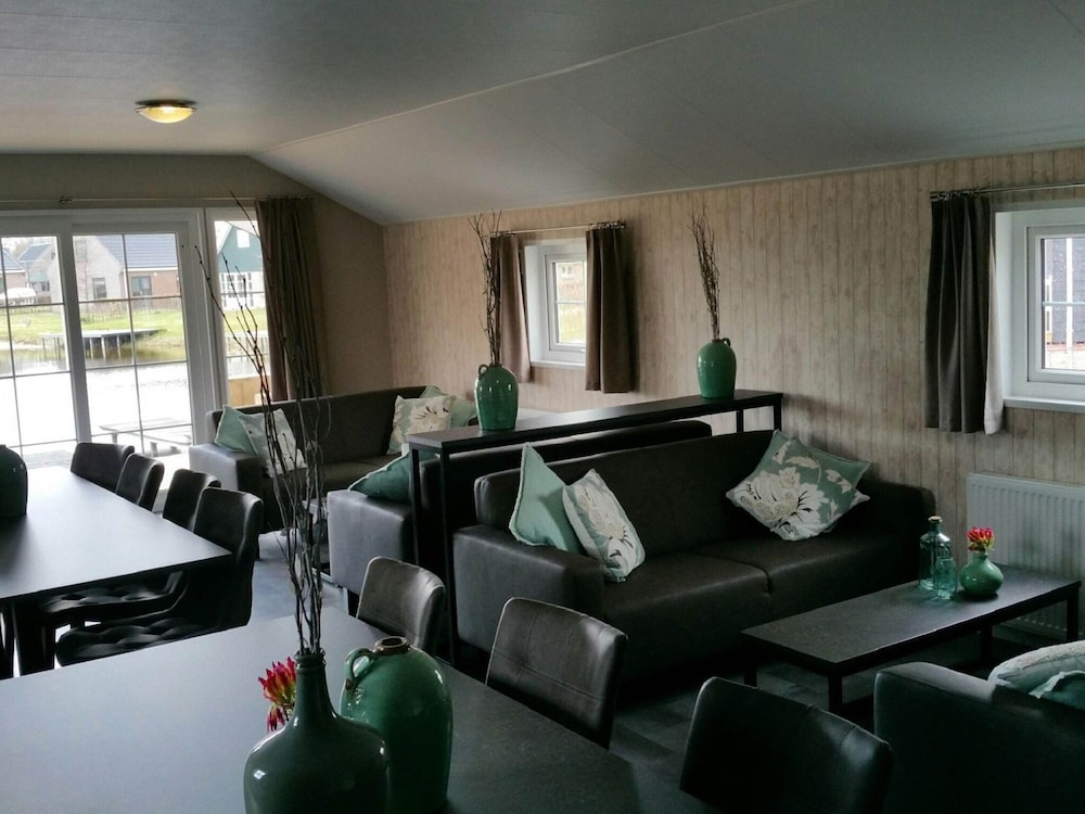 combined chalets with a bathroom located near a pond