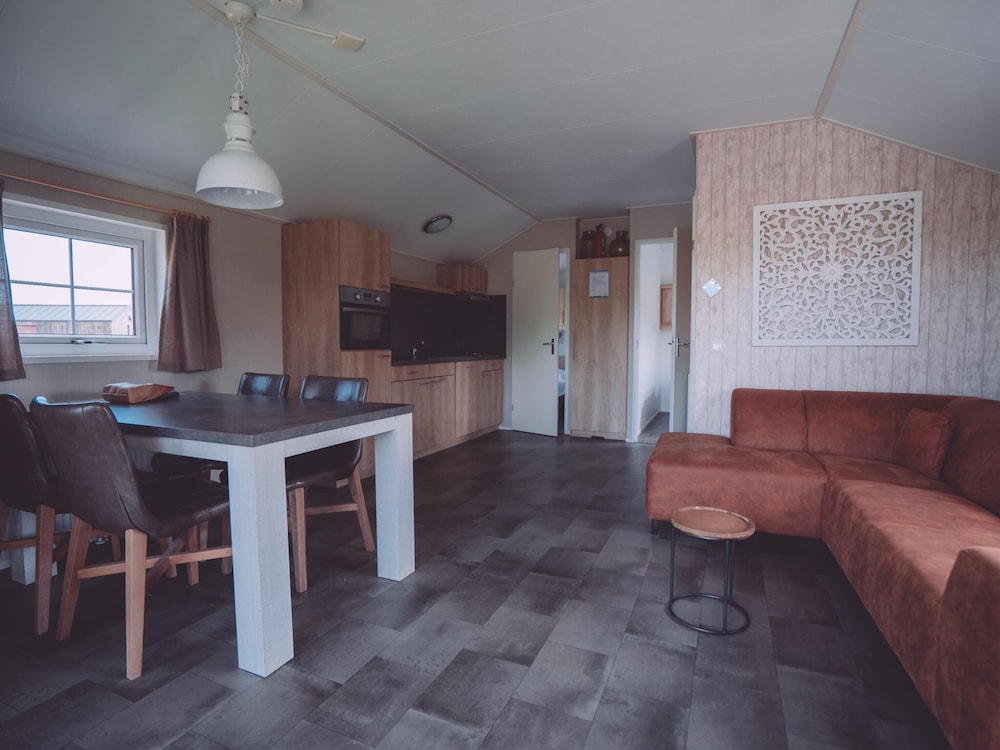 combined chalets with a bathroom located near a pond