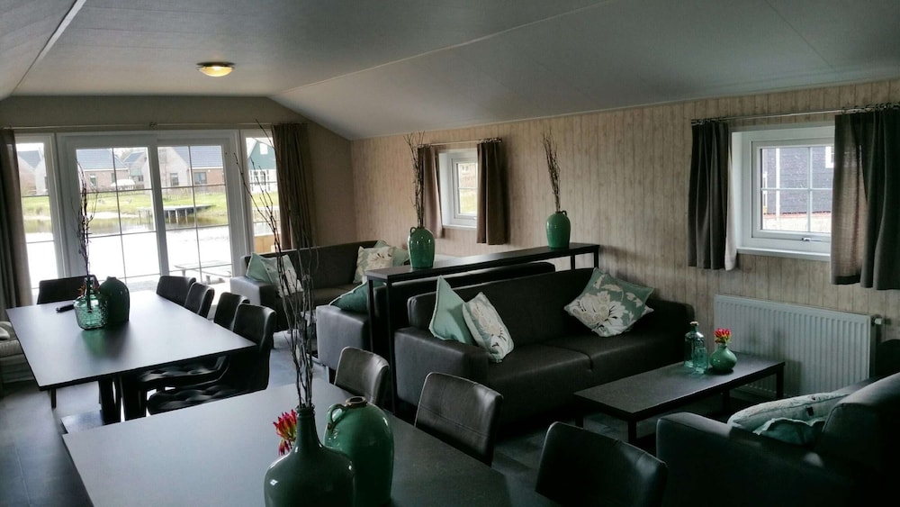 combined chalets with a bathroom located near a pond