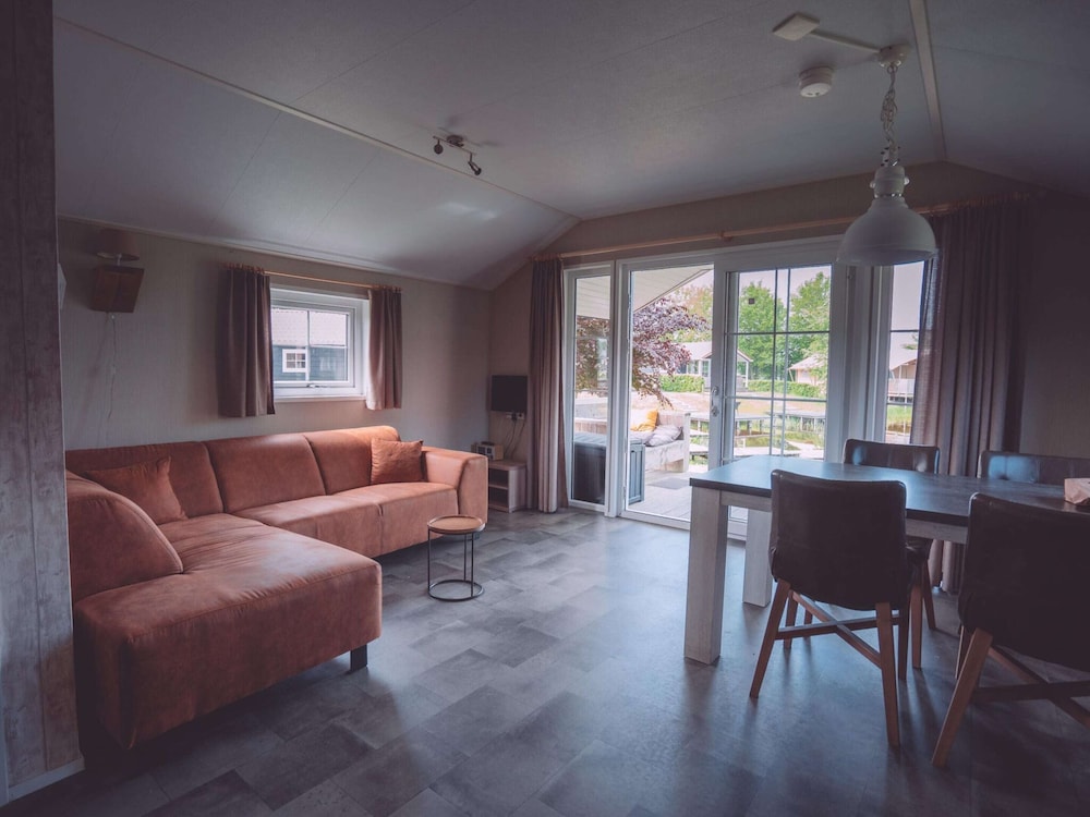 combined chalets with a bathroom located near a pond