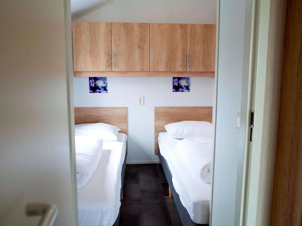 combined chalets with a bathroom located near a pond