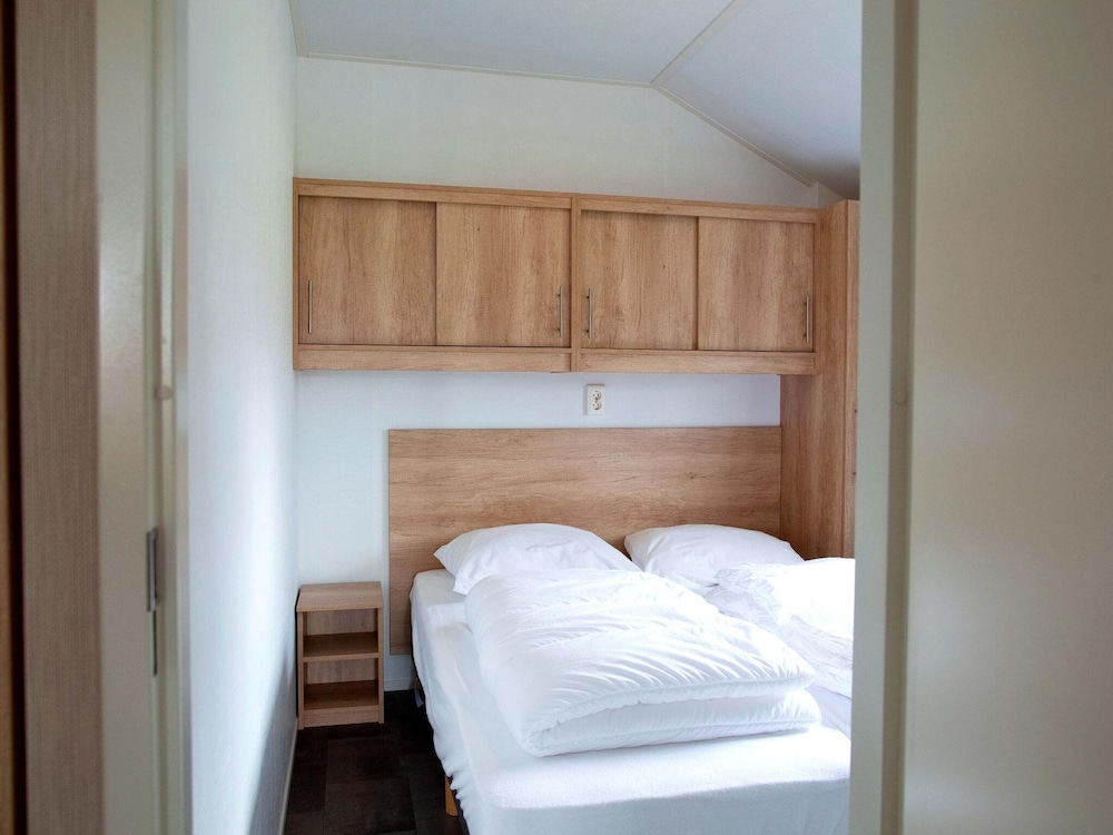 combined chalets with a bathroom located near a pond