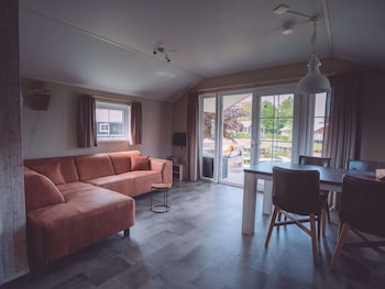 combined chalets with a bathroom located near a pond