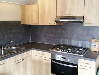 combined chalets with a bathroom located near a pond