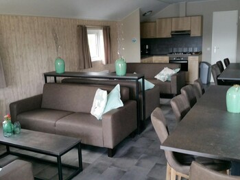 combined chalets with a bathroom located near a pond