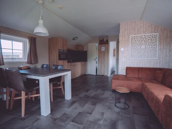 combined chalets with a bathroom located near a pond