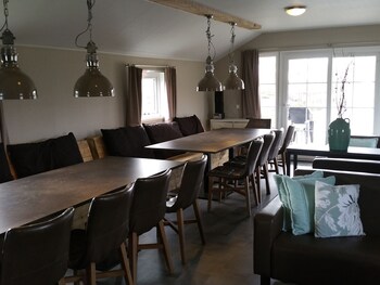 combined chalets with a bathroom located near a pond