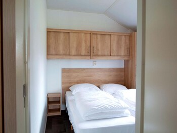 combined chalets with a bathroom located near a pond