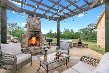 new luxury home with fire pit and hill country views