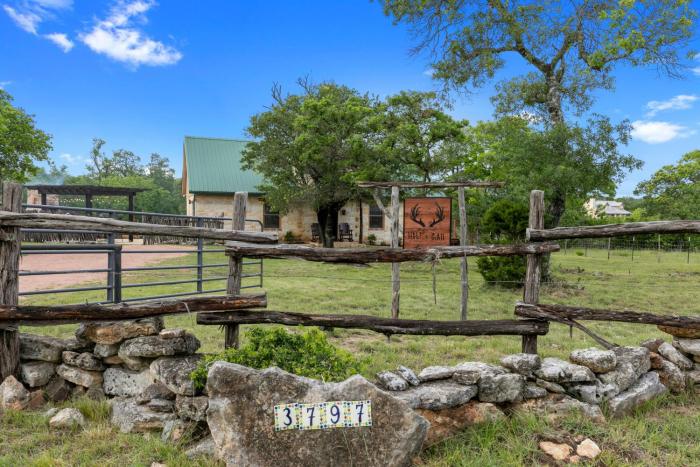 new luxury home with fire pit and hill country views