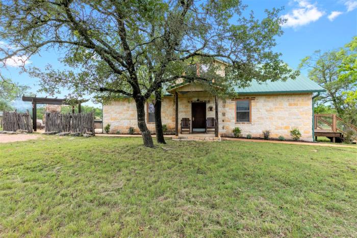 new luxury home with fire pit and hill country views