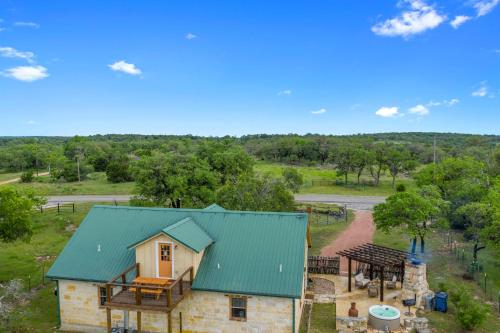 new luxury home with fire pit and hill country views