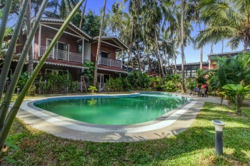 capital o 702282 coco farm resort