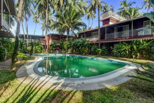 capital o 702282 coco farm resort