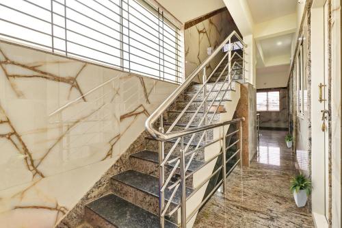 spot on sapthagiri residency