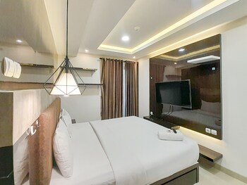 spacious and elegant 1br at patraland amarta apartment