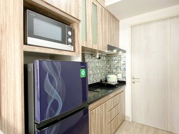homey and compact studio at azalea suites apartment