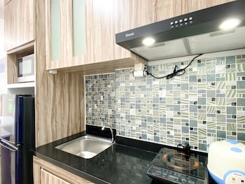 homey and compact studio at azalea suites apartment