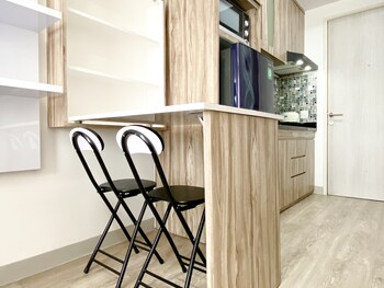 homey and compact studio at azalea suites apartment