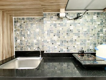 homey and compact studio at azalea suites apartment