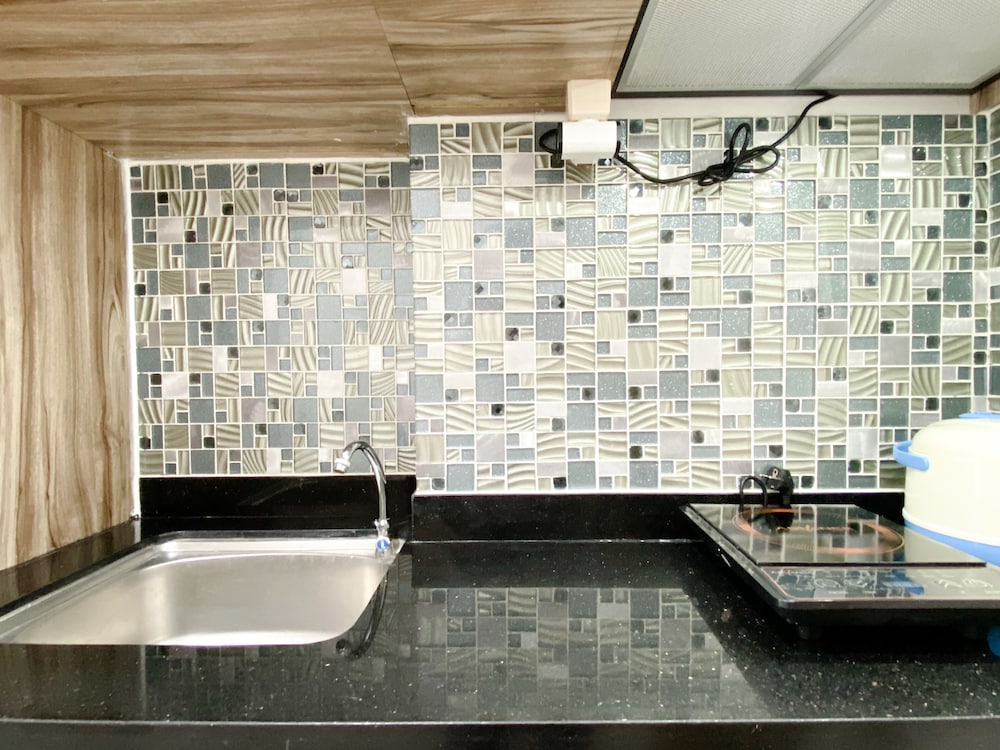 homey and compact studio at azalea suites apartment