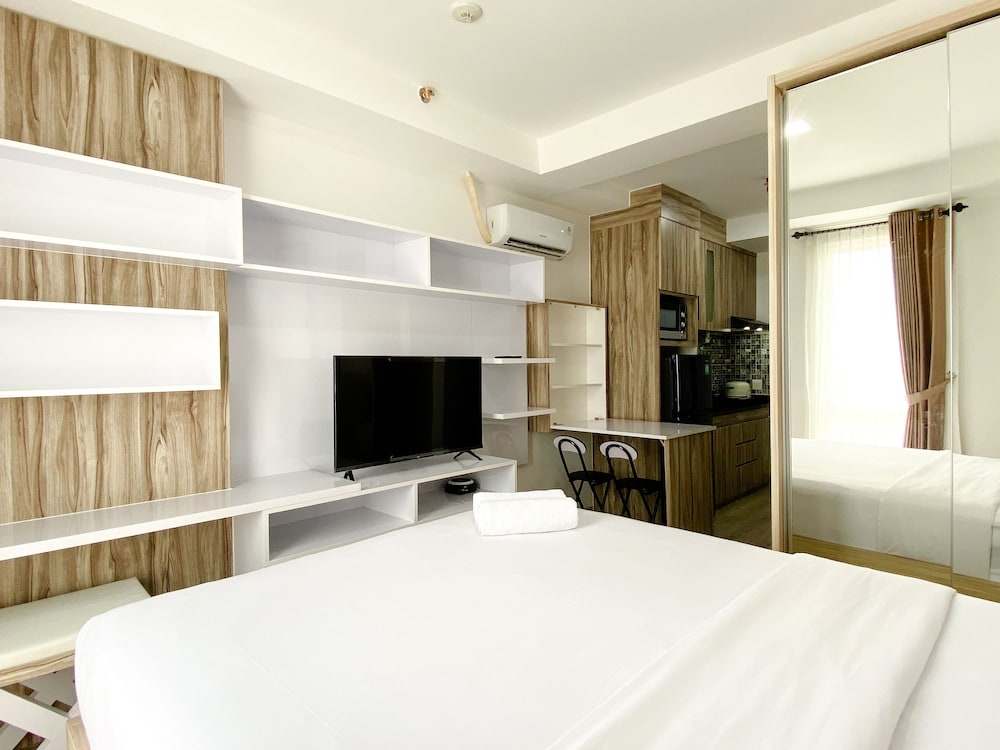 homey and compact studio at azalea suites apartment