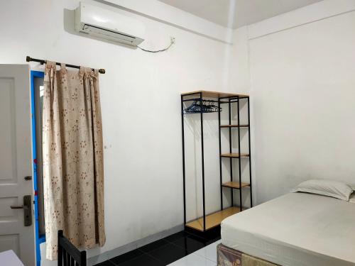 oyo 93295 wisma aluh ambak