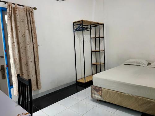 oyo 93295 wisma aluh ambak