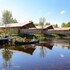 campsite combined tents with kitchen and bathroom located near a pond